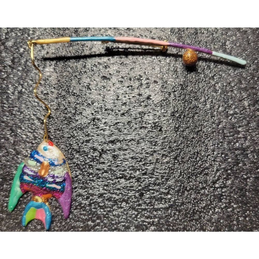 Colorful fishpole with a beautiful catch